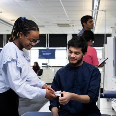 Students working in a pharmacy context