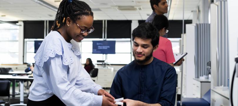 Students working in a pharmacy context