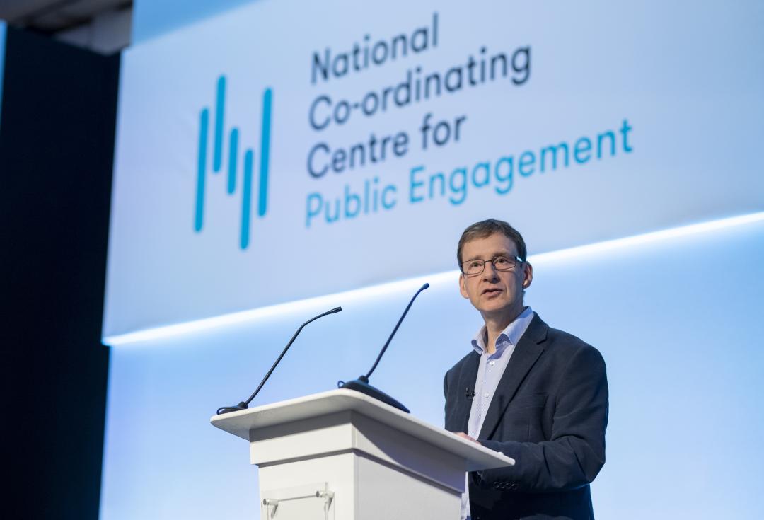 Steven Hill speaking on stage at Engage conference